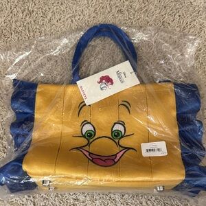 NWT: Harvey’s Disney Yellow and Blue Flounder Bag